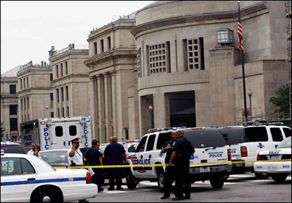 Police gather in front of the Holocaust Museum in Washington, D.C., following yesterday's shooting Police gather in front of the Holocaust Museum in Washington, D.C., following yesterday's shooting