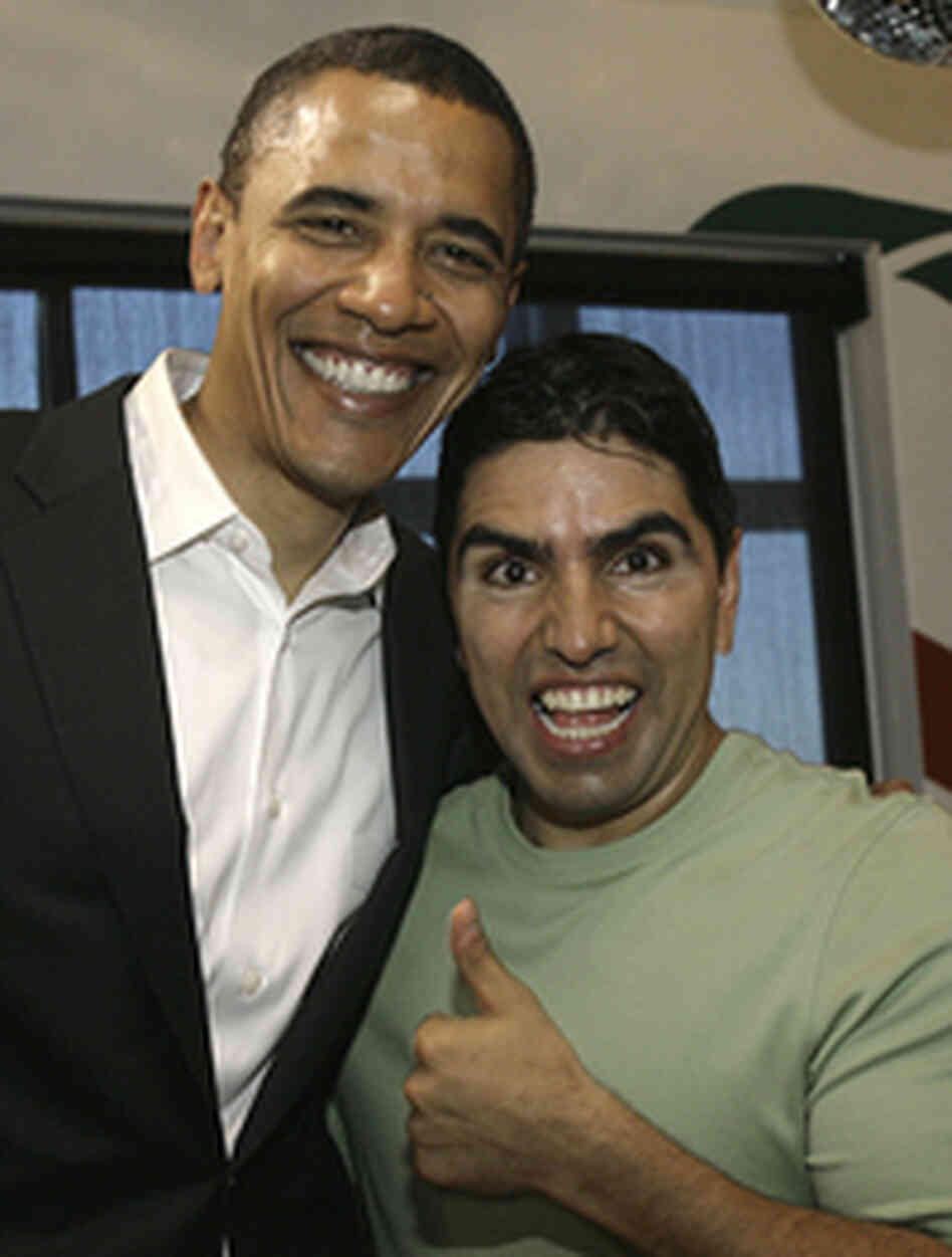 Then-presidential hopeful Barack Obama poses with radio host Eddie "Piolin" Sotelo following a cha Then-presidential hopeful Barack Obama poses with radio host Eddie "Piolin" Sotelo following a cha