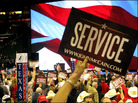 Crowd members wave signs of "Service" for GOP nominee Sen. John McCain at the Republican National Crowd members wave signs of "Service" for GOP nominee Sen. John McCain at the Republican National
