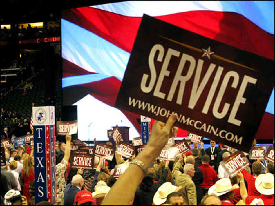 Crowd members wave signs of "Service" for GOP nominee Sen. John McCain at the Republican National Crowd members wave signs of "Service" for GOP nominee Sen. John McCain at the Republican National