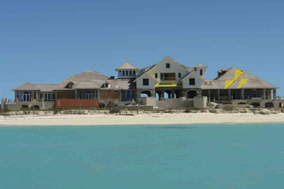 An unfinished resort hotel is seen on the small undeveloped island of West Caicos, in the Turks and An unfinished resort hotel is seen on the small undeveloped island of West Caicos, in the Turks and