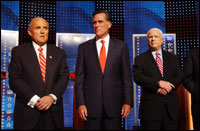 Former New York City Mayor Rudy Giuliani (left), former Massachusetts Gov. Mitt Romney (center) and Sen. John McCain, appear at a GOP debate. Photo by Darren McCollester/Getty Images.