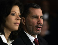 New York Gov. David Paterson discusses marital infidelities as his wife Michelle Paterson looks on.