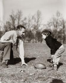 Father and Son Playing Football