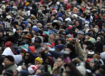 Crowds watching Obama.