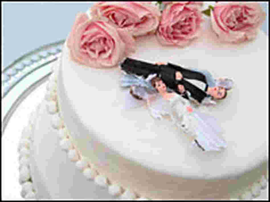 Broken figurines on a wedding cake Broken figurines on a wedding cake