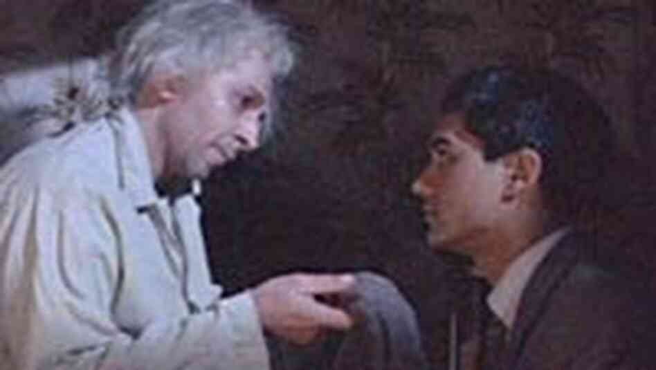 Papa (Roshan Seth) scolds Omar for accepting a job running his uncle's laundrette. Papa (Roshan Seth) scolds Omar for accepting a job running his uncle's laundrette.