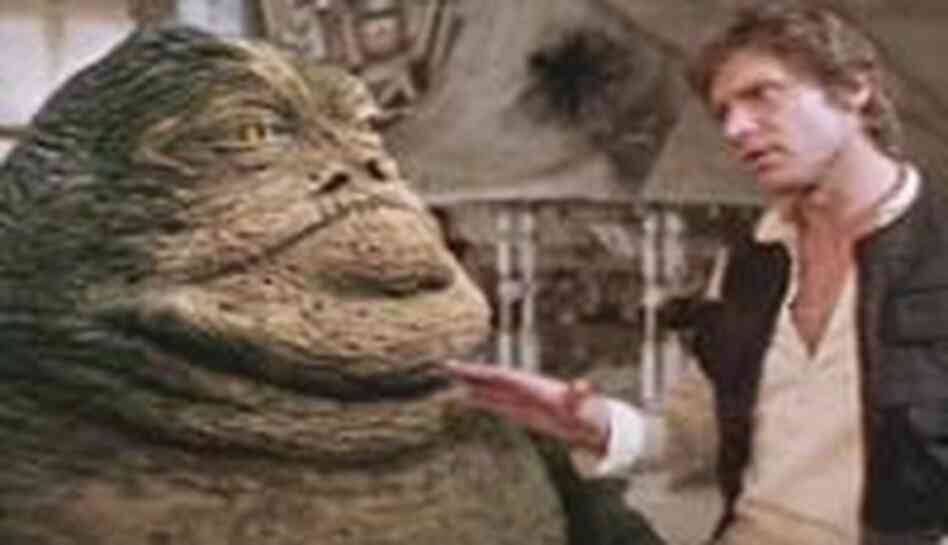 Han Solo (Harrison Ford) confronts gangster boss Jabba the Hut about a debt. Han Solo (Harrison Ford) confronts gangster boss Jabba the Hut about a debt.