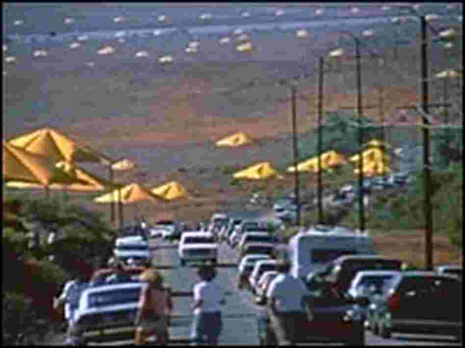 Curious onlookers pile out of their cars to get a better view of the 1991 "Umbrellas" project Curious onlookers pile out of their cars to get a better view of the 1991 "Umbrellas" project