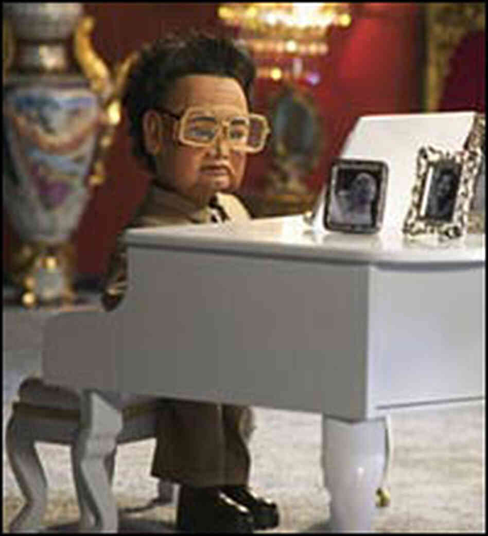 Kim Jong Il in a quiet moment at his North Korean palace/fortress. Kim Jong Il in a quiet moment at his North Korean palace/fortress.