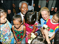 United Nations Secretary-General Kofi Annan  and his wife Nane talk with HIV-infected children at a hospital in Bangkok. Credit: Reuters