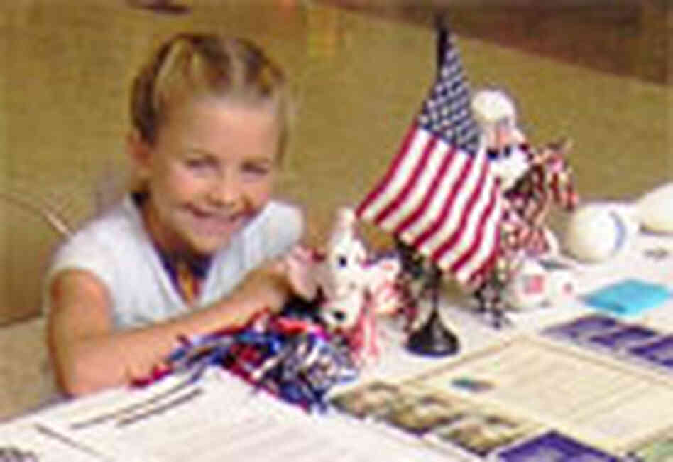 A smiling Lily Thorpe, 10, sits at a display table in a shopping mall. A smiling Lily Thorpe, 10, sits at a display table in a shopping mall.