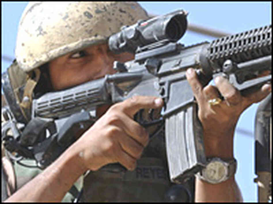 The commander of a U.S. Army Abrams tank aims at a Shiite militant position Najaf, Aug. 19, 2004. The commander of a U.S. Army Abrams tank aims at a Shiite militant position Najaf, Aug. 19, 2004.