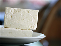 Feta is a brined, aged curd cheese, traditionally made with at least 70 percent sheep's milk. In Greece, it's a feature of many dishes, often paired with olive oil, herbs and sun-ripened tomatoes.
