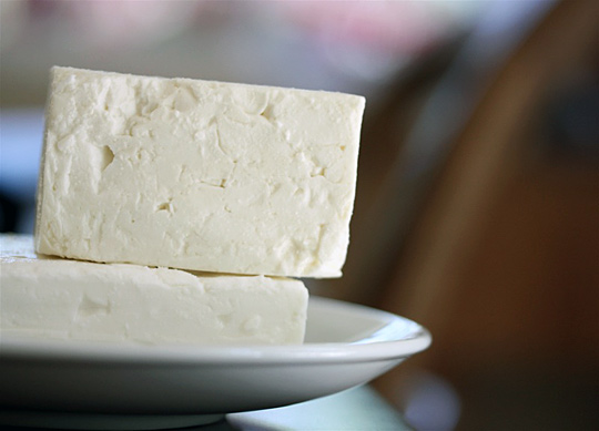 Feta is a brined, aged curd cheese.