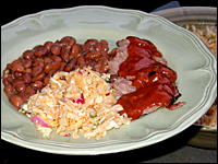 A Texas-inspired meal features slow-cooked beef brisket — with sauce added after cooking — and sides of pinto beans and coleslaw.