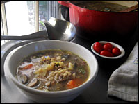 Hearty potato chunks and barley — and a bright garnish of dill and sour cream — make wild mushroom soup an autumn staple.