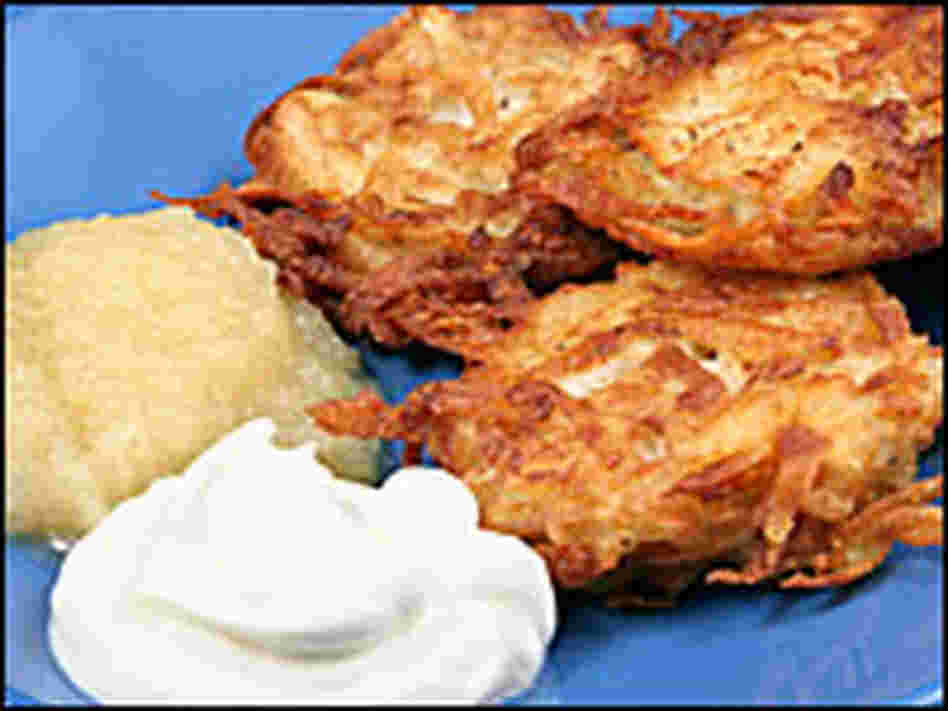 Potato latkes with sour cream and applesauce Potato latkes with sour cream and applesauce