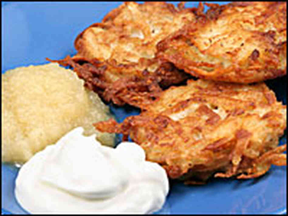 Potato latkes with sour cream and applesauce Potato latkes with sour cream and applesauce
