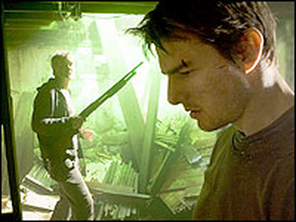 Tom Cruise and Tim Robbins, holding a shotgun, in 'War of the Worlds' Tom Cruise and Tim Robbins, holding a shotgun, in 'War of the Worlds'