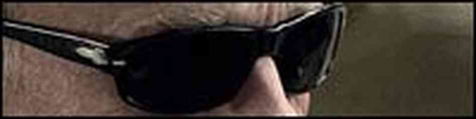 Very tight shot of Ed Harris eyes hidden behind sunglasses. Very tight shot of Ed Harris eyes hidden behind sunglasses.