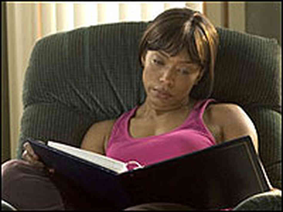 Angela Bassett looks at a photo album in a scene from 'Akeelah and the Bee.' Angela Bassett looks at a photo album in a scene from 'Akeelah and the Bee.'