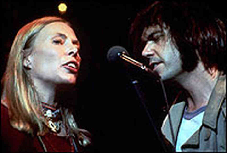 Joni Mitchell and Neil Young, singing together in 1978 in scene from The Last Waltz. Joni Mitchell and Neil Young, singing together in 1978 in scene from The Last Waltz.