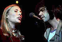 Joni Mitchell and Neil Young, singing together in 1978 in scene from The Last Waltz. Joni Mitchell and Neil Young, singing together in 1978 in scene from The Last Waltz.
