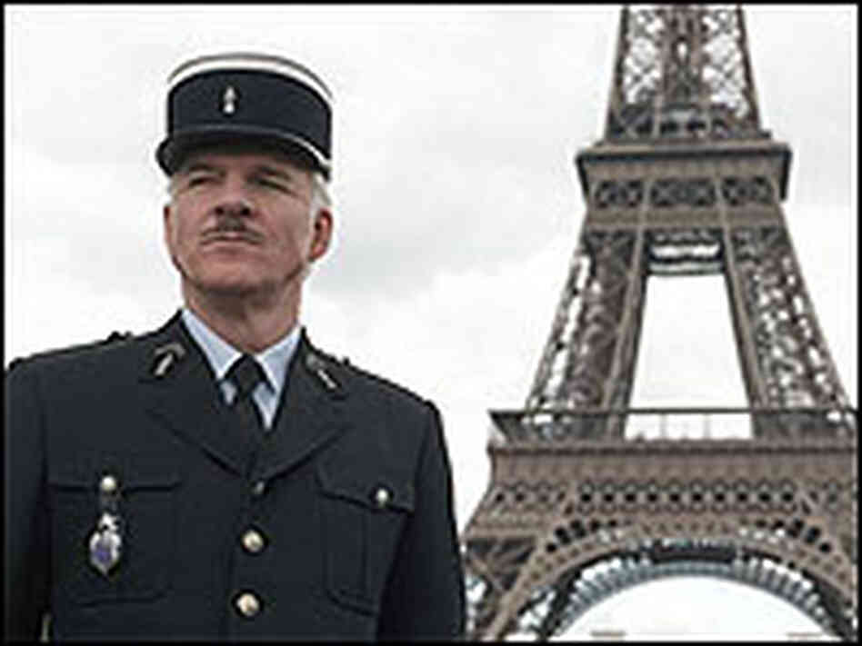 Steve Martin as Inspector Jacques Clouseau, posing with the Eiffel Tower as a backdrop. Steve Martin as Inspector Jacques Clouseau, posing with the Eiffel Tower as a backdrop.