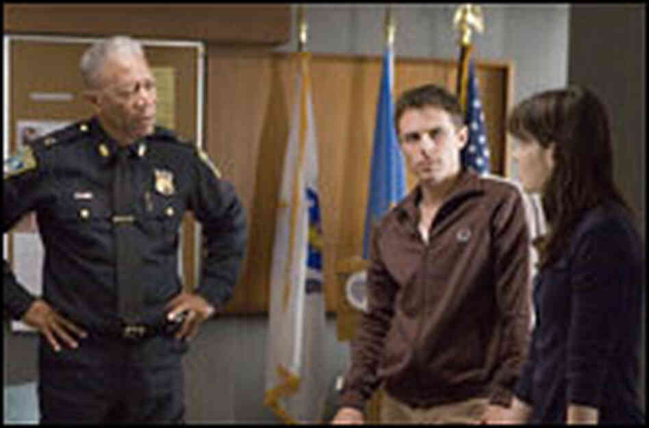 Morgan Freeman as Doyle, Casey Affleck as Patrick, and Michelle Monaghan as Angie