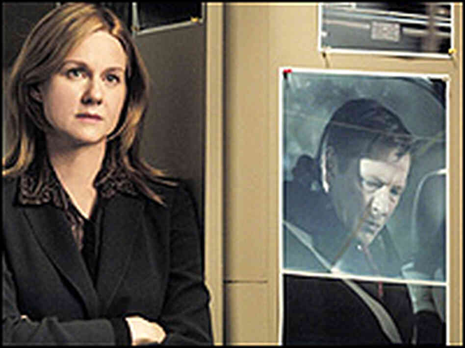 Laura Linney with a poster of Chris Cooper as Robert Hanssen. Laura Linney with a poster of Chris Cooper as Robert Hanssen.