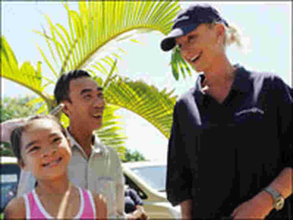Cindy McCain meets with Le Thi Phuoc and her father, Le Van, at hospital in Vietnam in June.