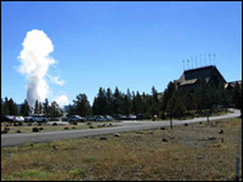 Old Faithful erupts just steps away from the geyser's namesake, the Old Faithful Inn.