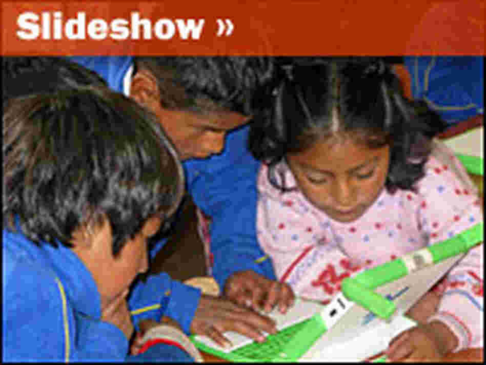 Students crowd around little green laptops provided free by Peru's government.