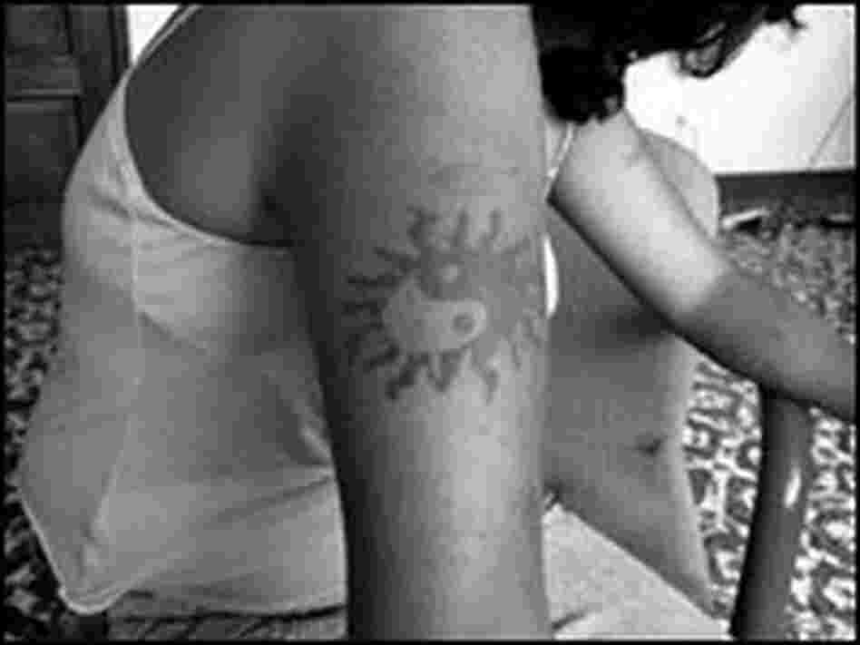 A 17-year-old former gang member, Babyface, says she covers her tattoos when she goes out.