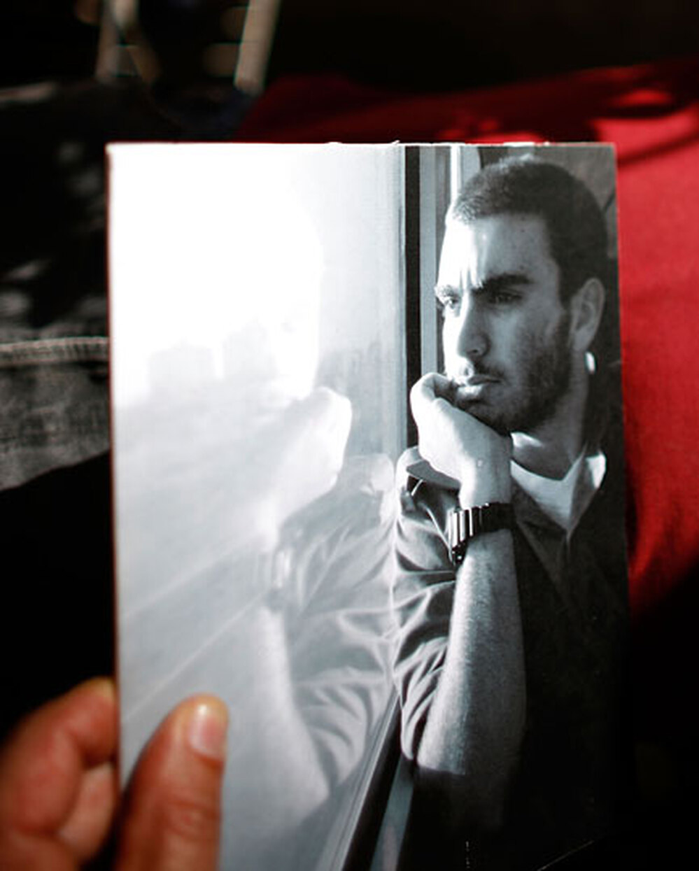 Klok Sa'ar holds a photo of his son, Yuval, who is serving in the Israeli army