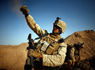 Cpl. Daniel Clift tosses a handful of rocks to simulate tossing a smoke grenade in Afghanistan. Cpl. Daniel Clift tosses a handful of rocks to simulate tossing a smoke grenade in Afghanistan.