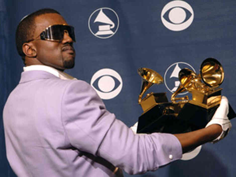 Kanye West shows off his Grammy haul after the 2006 awards. Kanye West shows off his Grammy haul after the 2006 awards.