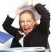 a woman holds a stack of papers aloft in anger; credit: iStockphoto.com