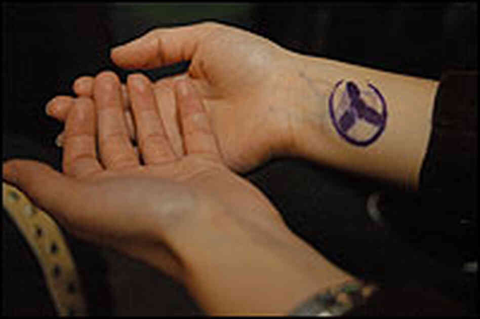 A pair of hands with a festival stamp A pair of hands with a festival stamp