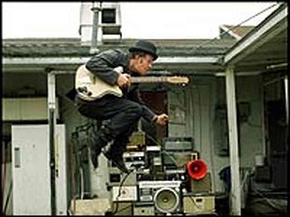 Tom Waits channels the ghost of some long-dead early rock idol — or a composite of ten of them. Tom Waits channels the ghost of some long-dead early rock idol — or a composite of ten of them.