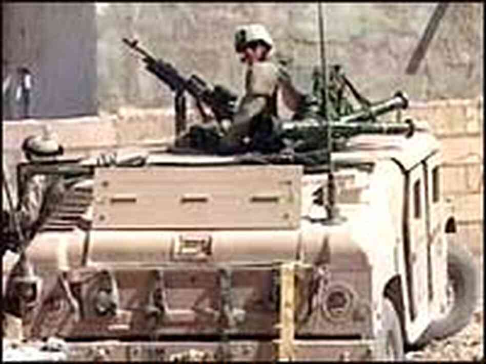 A video image shows U.S.-led forces on patrol in Najaf, Aug. 12, 2004. A video image shows U.S.-led forces on patrol in Najaf, Aug. 12, 2004.