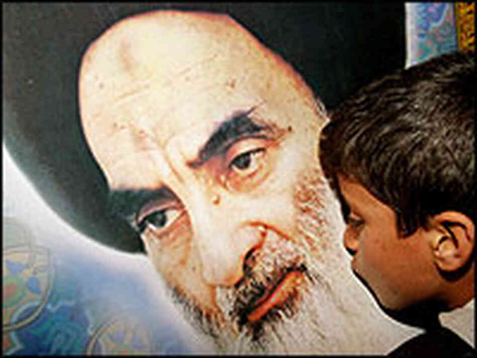 A boy kisses a photograph of Grand Ayatollah Ali Husseini al-Sistani A boy kisses a photograph of Grand Ayatollah Ali Husseini al-Sistani