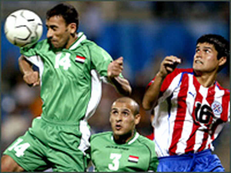 Iraqi soccer player heads ball in game vs. Paraguay Iraqi soccer player heads ball in game vs. Paraguay
