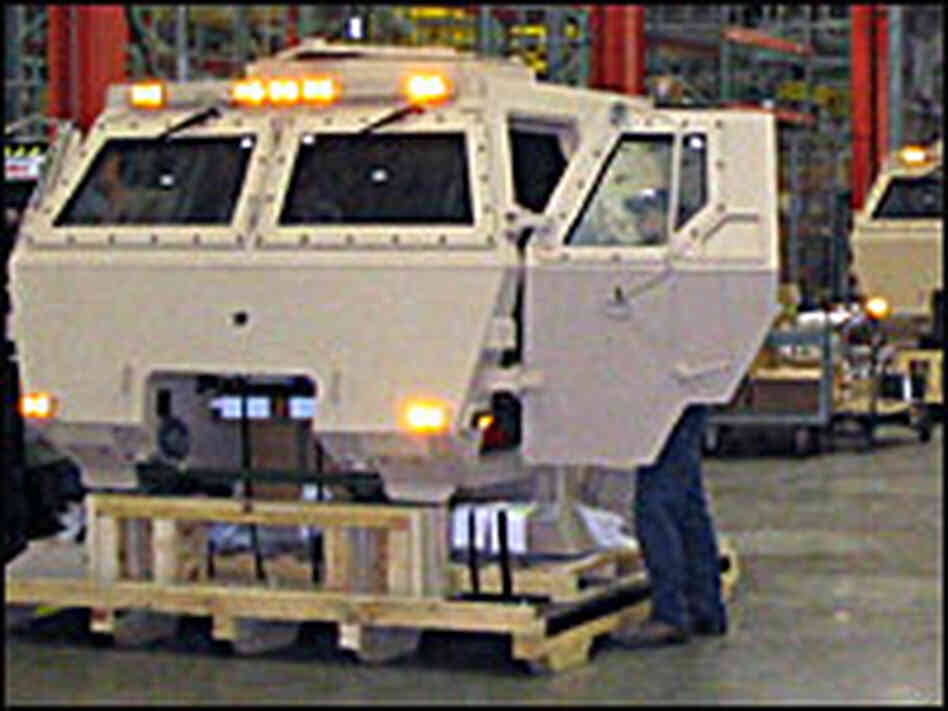 An armored cab on the assembly line An armored cab on the assembly line