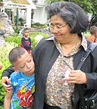 Krisana Kraisintu and a child living with HIV at the Camillian Social Center in Rayong, Thailand.