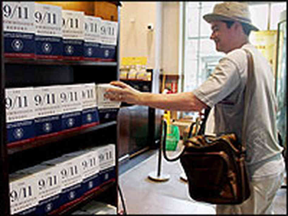 Man at New York bookstore with rack of Sept. 11 report covers. Man at New York bookstore with rack of Sept. 11 report covers.