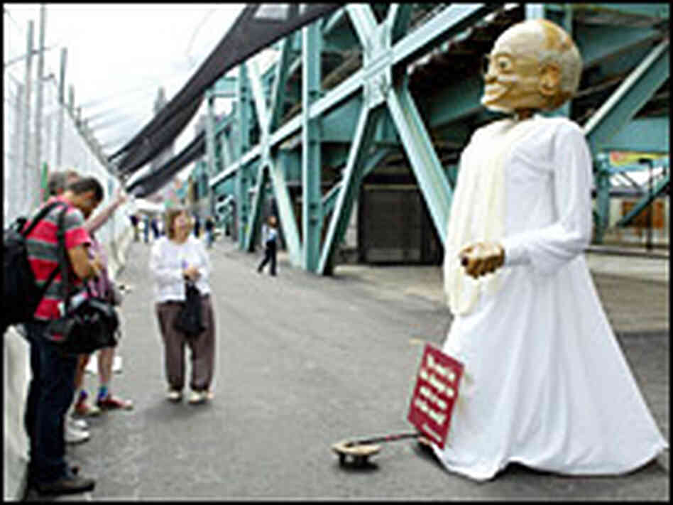 People view a large puppet of Mahatma Gandhi inside a protest area. Credit: Reuters People view a large puppet of Mahatma Gandhi inside a protest area. Credit: Reuters