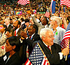 Delegates react to a speech by former presidential candidate Rev.Al Sharpton. Credit: Reuters