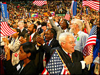 Delegates react to a speech by former presidential candidate Rev.Al Sharpton. Credit: Reuters